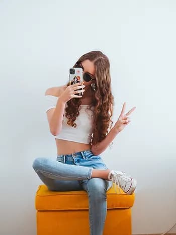 A girl taking a selfie.